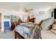 Comfortable bedroom featuring a spacious bed, dresser with mounted TV, and neutral colors to give off a cozy vibe at 17801 N 43Rd Way, Phoenix, AZ 85032