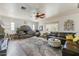 Cozy living room featuring a stone fireplace, neutral color palette, and comfortable seating at 17801 N 43Rd Way, Phoenix, AZ 85032