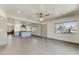 Open-concept living room with tile floors, recessed lighting, a view of the kitchen, and a modern ceiling fan at 17801 N 43Rd Way, Phoenix, AZ 85032