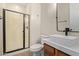 Well-lit bathroom featuring a modern sink, marble countertop, and glass shower door at 17902 N 93Rd Way, Scottsdale, AZ 85255