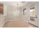 The dining area features a modern light fixture and access to the outdoor patio at 17902 N 93Rd Way, Scottsdale, AZ 85255