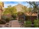 Inviting front entrance with desert landscaping and mountain views beyond at 17902 N 93Rd Way, Scottsdale, AZ 85255