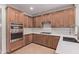 Updated kitchen featuring stainless steel oven, cooktop, and countertops at 17902 N 93Rd Way, Scottsdale, AZ 85255