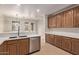 Modern kitchen with updated cabinets, stainless steel appliances, and barstool seating at 17902 N 93Rd Way, Scottsdale, AZ 85255