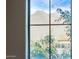 Mountain view through a window framed by greenery and a tiled roof at 17902 N 93Rd Way, Scottsdale, AZ 85255