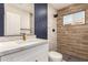 Bathroom features a wood-look tiled shower, granite counters, and a blue accent wall at 1827 E Jarvis Ave, Mesa, AZ 85204