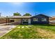 Charming single-story home with well-maintained lawn and inviting front entrance at 1827 E Jarvis Ave, Mesa, AZ 85204