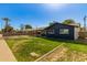 This exterior shot showcases a well-maintained lawn and a cozy single-story home at 1827 E Jarvis Ave, Mesa, AZ 85204