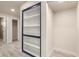 Hallway with built-in shelves and access to other rooms of the house at 1827 E Jarvis Ave, Mesa, AZ 85204