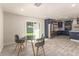 Modern kitchen with stainless steel appliances, gray tile floor and a glass sliding door at 1827 E Jarvis Ave, Mesa, AZ 85204