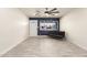 Cozy living room with modern tile floors and bright natural light from the front window at 1827 E Jarvis Ave, Mesa, AZ 85204