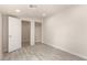 Room offers a bright interior, wood-look tile flooring, closet and an open doorway at 1827 E Jarvis Ave, Mesa, AZ 85204