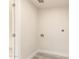 Room featuring tile floors, clean white walls, and a utility hookup for laundry at 1827 E Jarvis Ave, Mesa, AZ 85204