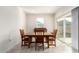 A formal dining room with tile flooring and natural light at 18621 W Hackamore Dr, Surprise, AZ 85387