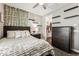 Bedroom with stylish decorations, a large window, and a fan, creating a cozy atmosphere at 19797 W Lincoln St, Buckeye, AZ 85326