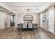 Elegant dining room with wood-look tile floors and a stylish light fixture at 19797 W Lincoln St, Buckeye, AZ 85326