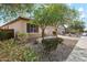 Charming single-story home featuring a tile roof, desert landscaping, and a two-car garage at 19797 W Lincoln St, Buckeye, AZ 85326