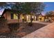 Exterior of home with desert landscaping, multiple garages, and a private driveway at 19797 W Lincoln St, Buckeye, AZ 85326