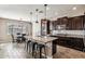 Spacious kitchen features a large center island with seating and modern stainless steel appliances at 19797 W Lincoln St, Buckeye, AZ 85326