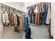 Organized walk-in closet with ample hanging space for clothes and accessories at 19797 W Lincoln St, Buckeye, AZ 85326