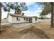 Spacious backyard featuring a patio area and a well-maintained exterior of the single-story home at 2032 W Eugie Ave, Phoenix, AZ 85029