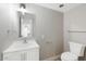 Clean bathroom with white vanity, modern fixtures, and a standard toilet at 2032 W Eugie Ave, Phoenix, AZ 85029