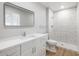 This bathroom features modern fixtures, a stone shower, and contemporary vanity at 2032 W Eugie Ave, Phoenix, AZ 85029