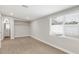 Bright bedroom featuring wood-look floors, a closet, and a window with blinds at 2032 W Eugie Ave, Phoenix, AZ 85029