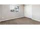 Carpeted bedroom with a closet and a sunlit window with blinds at 2032 W Eugie Ave, Phoenix, AZ 85029