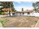 Charming single-story home with a brick exterior, complemented by an attached garage and green front yard at 2032 W Eugie Ave, Phoenix, AZ 85029