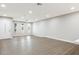 Bright, open living room featuring wood-look flooring, a ceiling fan, and an abundance of natural light at 2032 W Eugie Ave, Phoenix, AZ 85029