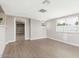 This living room features neutral walls, hardwood floors, and lots of natural light at 2032 W Eugie Ave, Phoenix, AZ 85029