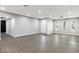 Spacious living room featuring wood floors, recessed lighting, and a decorative front door at 2032 W Eugie Ave, Phoenix, AZ 85029