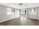 This living room features neutral walls, hardwood floors, and lots of natural light at 2032 W Eugie Ave, Phoenix, AZ 85029