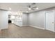 Inviting living space with wood-look floors adjacent to a kitchen with an island at 2032 W Eugie Ave, Phoenix, AZ 85029