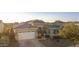 Aerial shot showing an attractive single-story home with a large garage, well-maintained landscaping, and a welcoming entrance at 20594 S 194Th Pl, Queen Creek, AZ 85142