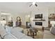 Comfortable living room with modern fireplace, shiplap wall, and stylish decor at 20594 S 194Th Pl, Queen Creek, AZ 85142