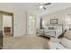 Serene main bedroom with generous space, plush carpet, and easy access to the ensuite bathroom at 20594 S 194Th Pl, Queen Creek, AZ 85142