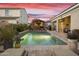 Beautiful pool in a backyard with a gazebo and seating under a colorful dusk sky at 20594 S 194Th Pl, Queen Creek, AZ 85142