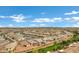 Expansive aerial view of a well-planned community with a picturesque pond and manicured landscaping at 20780 N Gardenia Rd, Maricopa, AZ 85138