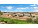 Scenic aerial view of a meticulously planned housing community, featuring well-maintained homes and landscaping at 20780 N Gardenia Rd, Maricopa, AZ 85138