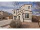 Beautiful home exterior showcasing the garage, entry and desert landscaping under a partly cloudy sky at 21266 E Via De Olivos --, Queen Creek, AZ 85142