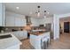 Open kitchen featuring stainless steel appliances, wooden countertops, white cabinets and pendant lights at 21266 E Via De Olivos --, Queen Creek, AZ 85142