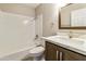 Bathroom featuring shower-tub combo and stylish vanity at 2530 E Randall Dr, Tempe, AZ 85288