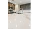 Bright kitchen with stainless steel sink, modern faucet, and white quartz countertops at 2530 E Randall Dr, Tempe, AZ 85288