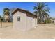 An exterior shot of the storage shed, nestled among trees, adds functional charm at 2530 E Randall Dr, Tempe, AZ 85288