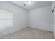 Modest bedroom with tile floor and a window offering natural light and a built-in closet at 2540 E Atlanta Ave, Phoenix, AZ 85040