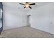 Bright, airy bedroom with tile flooring, ceiling fan, and ample space for personalization at 2540 E Atlanta Ave, Phoenix, AZ 85040