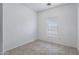 Bright, tiled bedroom with window offering natural light and neutral color palette at 2540 E Atlanta Ave, Phoenix, AZ 85040