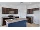 Beautiful kitchen featuring granite countertops, a center island, and stainless steel appliances at 2540 E Atlanta Ave, Phoenix, AZ 85040